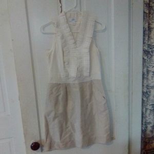 Loft ruffled neckline shimmer tan lined skirt with pattie pockets.